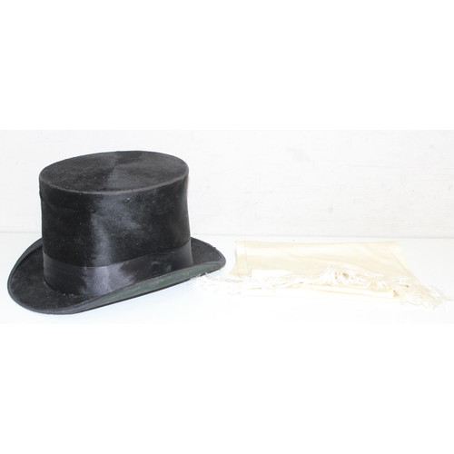 206 - An antique silk top hat by Dunn & Co, large but unattributed size and a white silk scarf