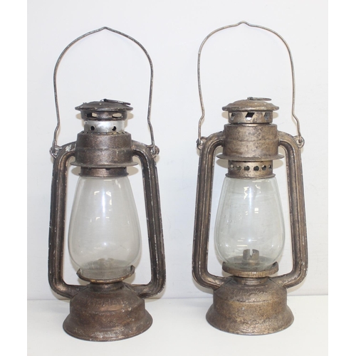 232 - 2 vintage hurricane lamps by Rabhat, the largest approx 33cm tall excluding handle