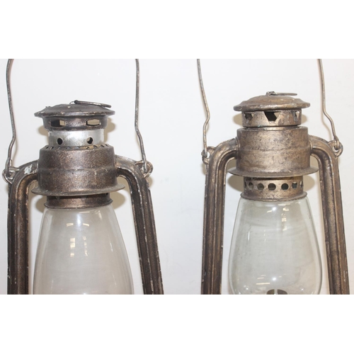 232 - 2 vintage hurricane lamps by Rabhat, the largest approx 33cm tall excluding handle