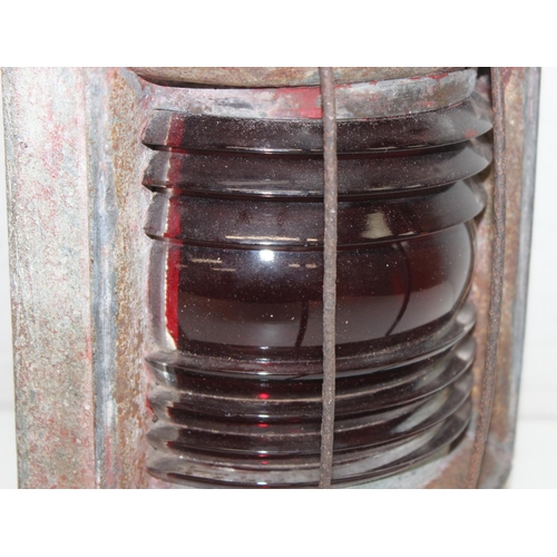 238 - A vintage weathered ship's port lamp with red glass, approx 35cm tall