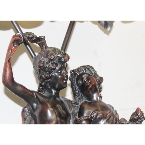 239 - Bronzed classical style lamp with classical lovers decoration, approx 79cm tall