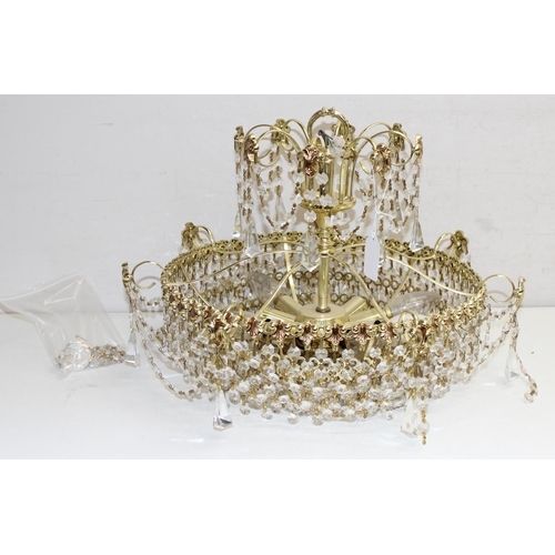 243 - Vintage 2-tier brass and crystal chandelier, approx 35cm H