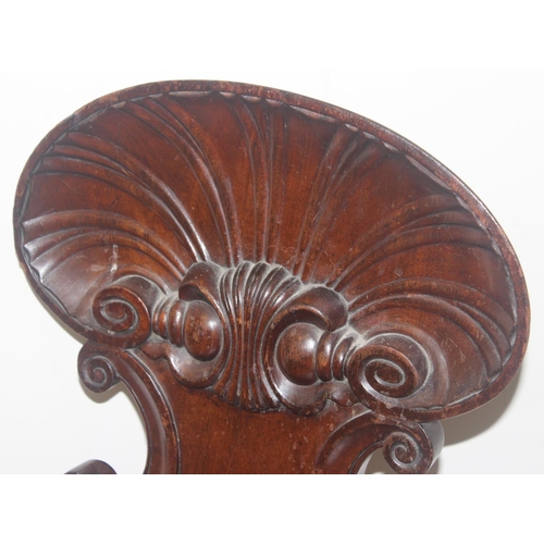 131 - In the manner of Gillows, a 19th century mahogany hall chair with shell shaped carved back, approx 8... 