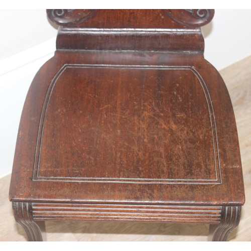 131 - In the manner of Gillows, a 19th century mahogany hall chair with shell shaped carved back, approx 8... 