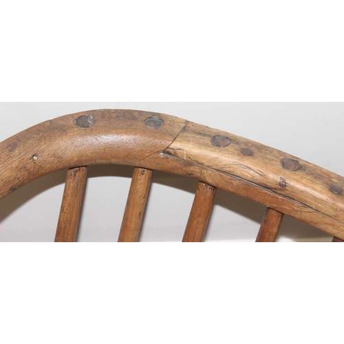 136 - An unusual antique stick back chair with elm seat, possibly a Welsh yoke backed chair, 19th century ... 