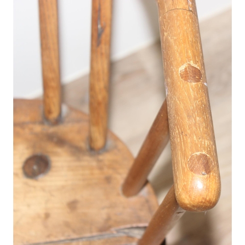 136 - An unusual antique stick back chair with elm seat, possibly a Welsh yoke backed chair, 19th century ... 