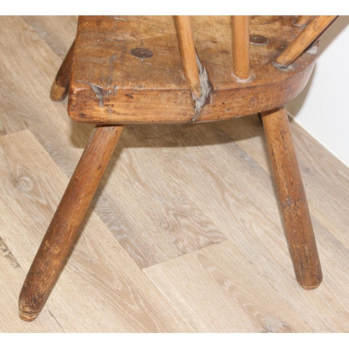 136 - An unusual antique stick back chair with elm seat, possibly a Welsh yoke backed chair, 19th century ... 