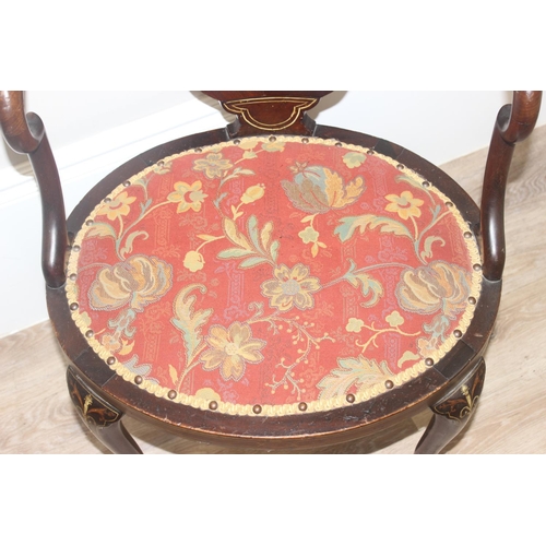 134 - A 19th century inlaid mahogany tub chair in the manner of James Shoolbred, with profuse marquetry in... 