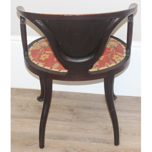 134 - A 19th century inlaid mahogany tub chair in the manner of James Shoolbred, with profuse marquetry in... 