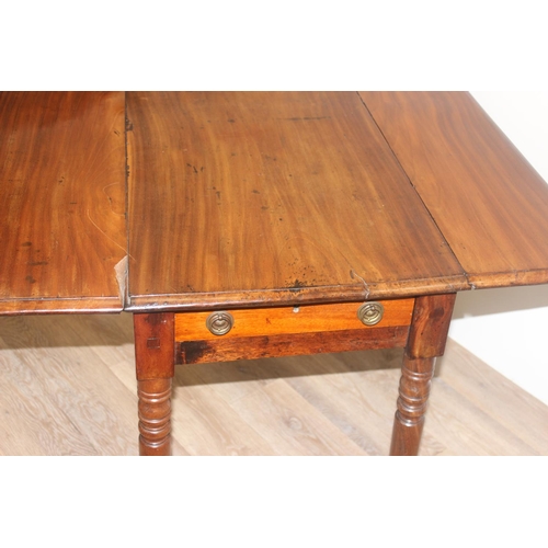 100 - A 19th century mahogany Pembroke table with turned legs and brass castors, approx 94cm (46cm when lo... 