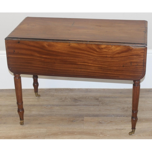 100 - A 19th century mahogany Pembroke table with turned legs and brass castors, approx 94cm (46cm when lo... 