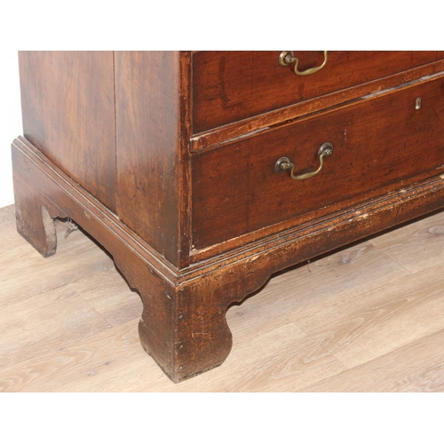 129 - A Georgian mahogany bureau with fitted interior, 4 long drawers with brass drop handles and bracket ... 