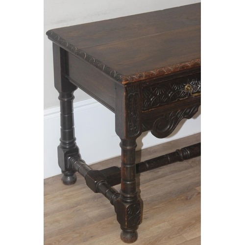 172 - A Jacobean or Carolean style carved oak hall or console table, likely early 20th century, with 2 dra... 