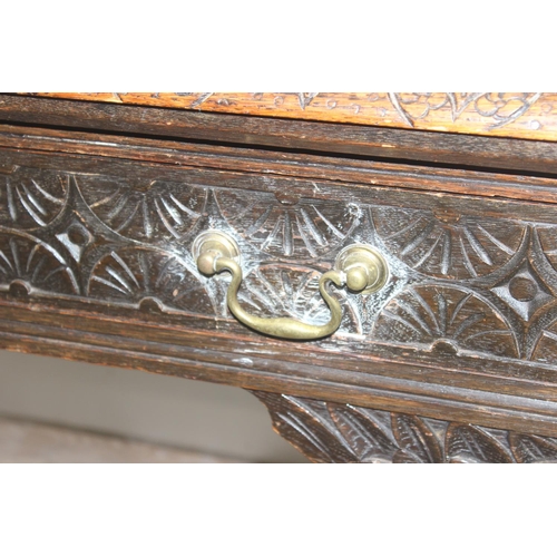 172 - A Jacobean or Carolean style carved oak hall or console table, likely early 20th century, with 2 dra... 