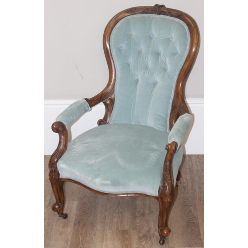 95 - A Victorian button backed nursing chair with turquoise upholstery and carved wooden exposed frame, a... 