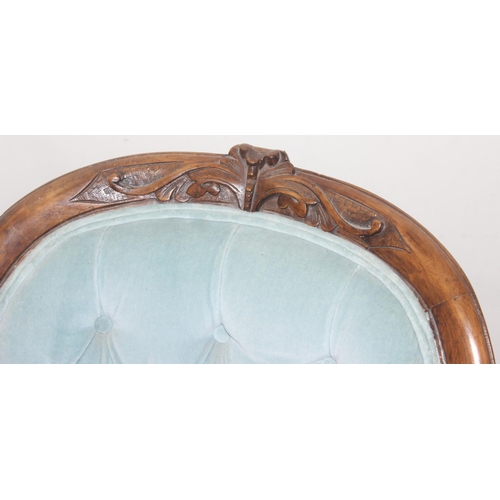 95 - A Victorian button backed nursing chair with turquoise upholstery and carved wooden exposed frame, a... 