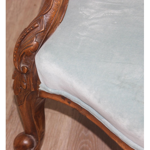 95 - A Victorian button backed nursing chair with turquoise upholstery and carved wooden exposed frame, a... 