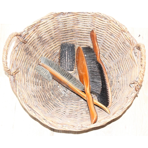 303 - Qty of assorted wicker items to inc a child's chair, 2 baskets and a qty of wooden clothes brushes e... 