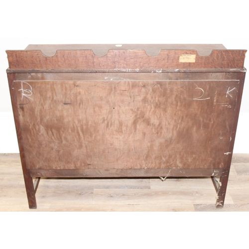 67 - A 17th century style oak sideboard with 2 drawers over 2 doors, brass drop handles, approx 122cm wid... 