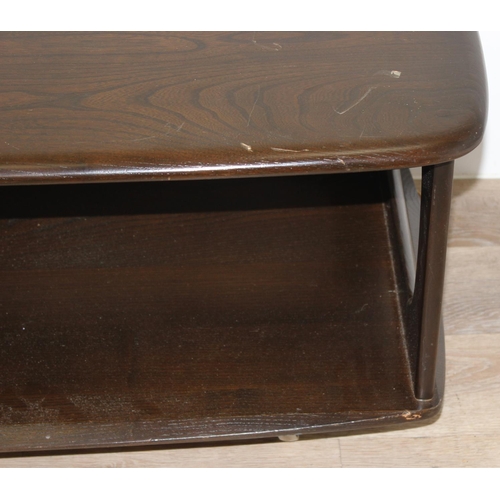 51 - An Ercol Minerva coffee table with 2 drawers, model 844, dark finish, approx 125cm wide x 54cm deep ... 