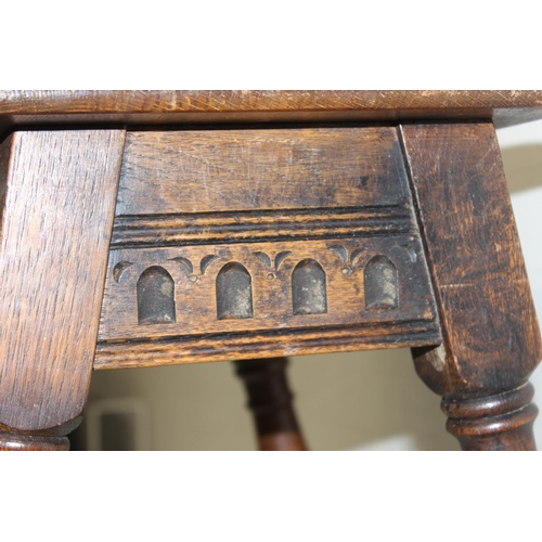 62 - An 18th century style oak coffin stool with carved details, by Old Charm, approx 45cm wide x 26cm de... 