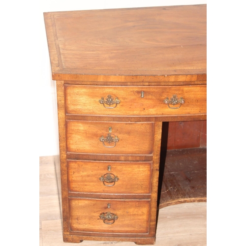 73 - A 19th century mahogany kneehole desk of 8 drawer construction with Georgian style brass handles, ap... 