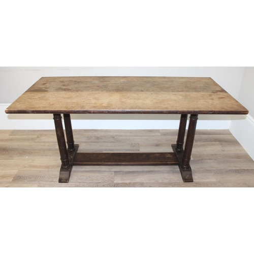 96 - An early 20th century oak refectory dining table with tuned wooden pillar supports, approx 168cm wid... 