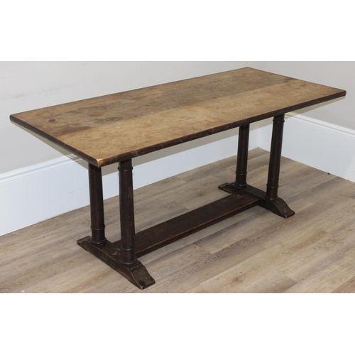 96 - An early 20th century oak refectory dining table with tuned wooden pillar supports, approx 168cm wid... 