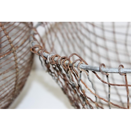 305 - 2 vintage wire baskets to incl an egg basket, largest approx 47cm W