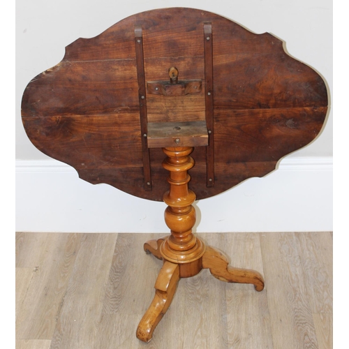 90 - An antique light wood veneered tilt topped table on tripod base, approx 102cm wide x 72cm deep x 70c... 