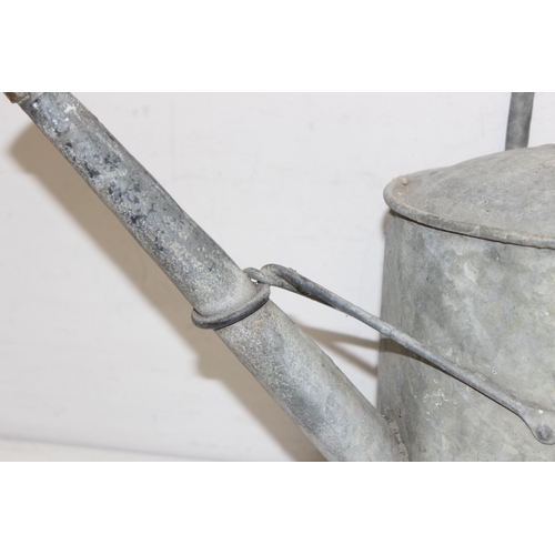 352 - 2 vintage galvanised watering cans, one 2 gallons and one smaller