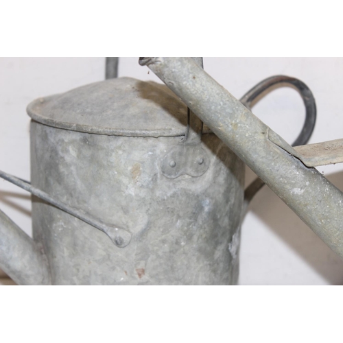 352 - 2 vintage galvanised watering cans, one 2 gallons and one smaller