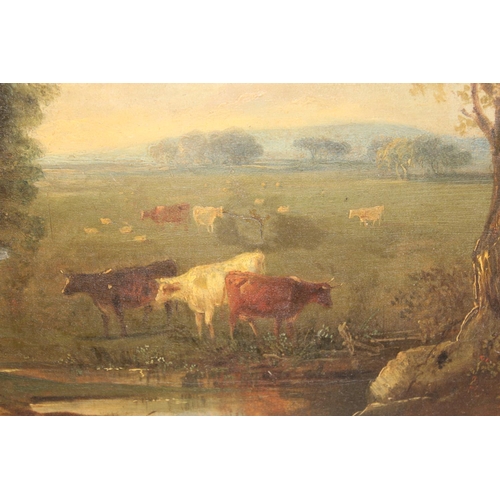 423 - A 19th century oil on canvas depicting cattle near a watering hole, unsigned, and an oil on board en... 