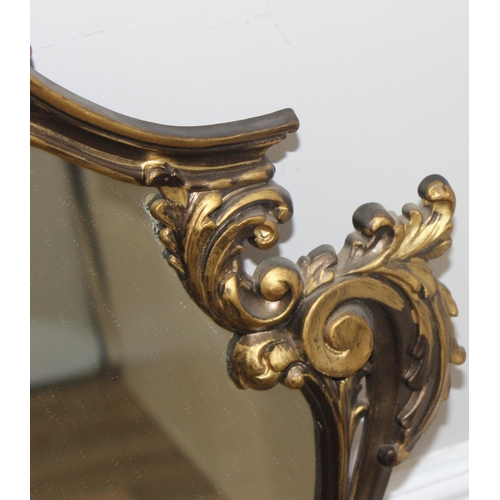 464 - Highly decorative Rococo style gilt framed wall hanging mirror, approx 53cm x 75cm