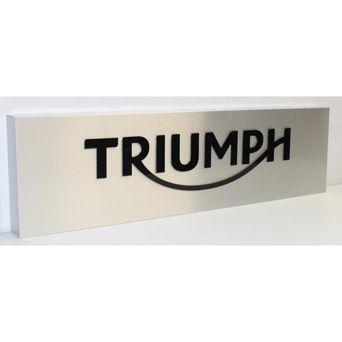 466 - Silver coloured metal Triumph Motorcycle wall display sign with polished black acrylic lettering, ap... 