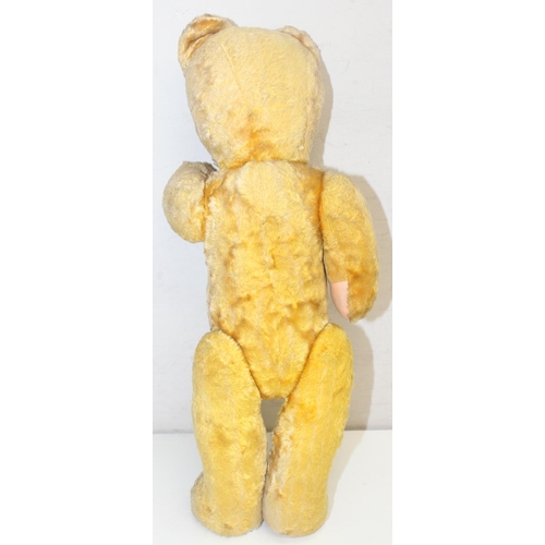 656 - 2 vintage teddy bears, one with growler and Foreign label, the larger approx 41cm tall