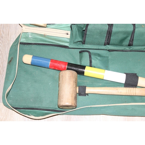 657 - A vintage 4 person Jacques croquet set in a fabric case