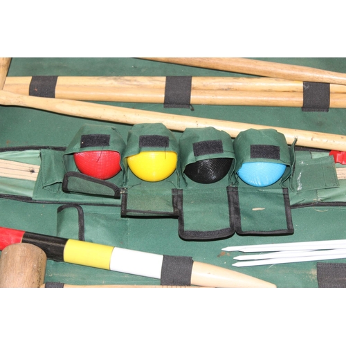 657 - A vintage 4 person Jacques croquet set in a fabric case