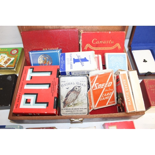 659 - Qty of vintage playing cards and card games in wooden box