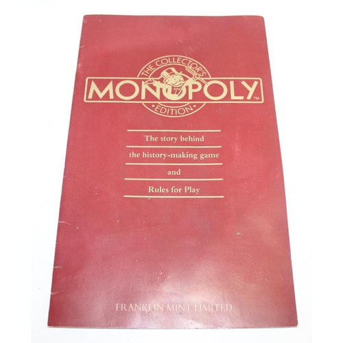 662 - Vintage Franklin Mint edition wooden Monopoly game board and contents, with gaming instructions, pro... 