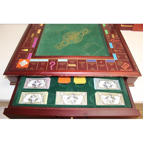 662 - Vintage Franklin Mint edition wooden Monopoly game board and contents, with gaming instructions, pro... 