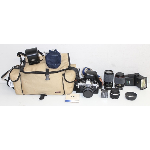 772 - Olympus OM10 camera in case with various accessories and lens etc