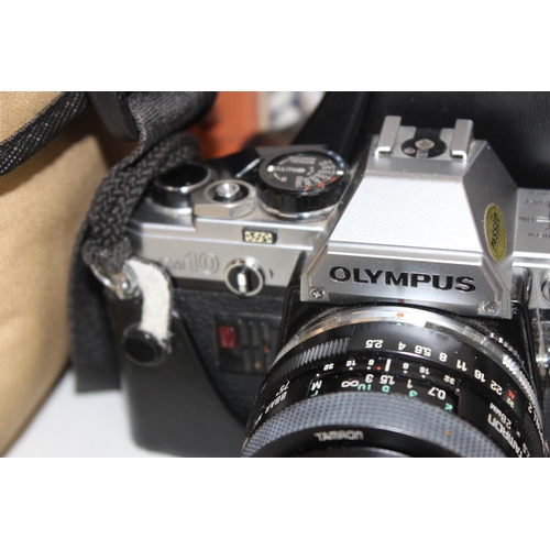 772 - Olympus OM10 camera in case with various accessories and lens etc