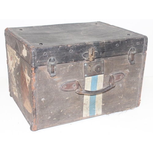 313 - 2 vintage trunks, one metal and one canvas with labels and 2 wicker baskets, the metal trunk approx ... 