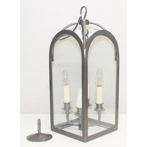 249 - Jim Lawrence Lighting, an antique style grey enamelled iron 4 glass hall lantern with 4 candle style... 