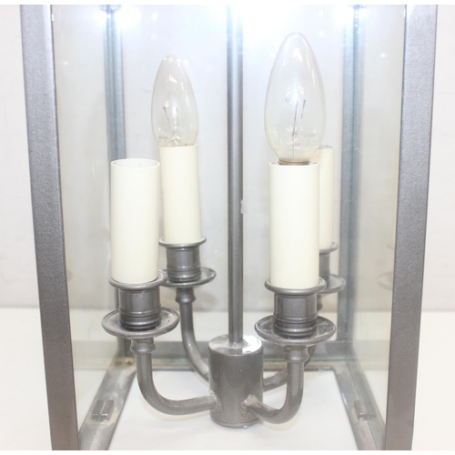 249 - Jim Lawrence Lighting, an antique style grey enamelled iron 4 glass hall lantern with 4 candle style... 