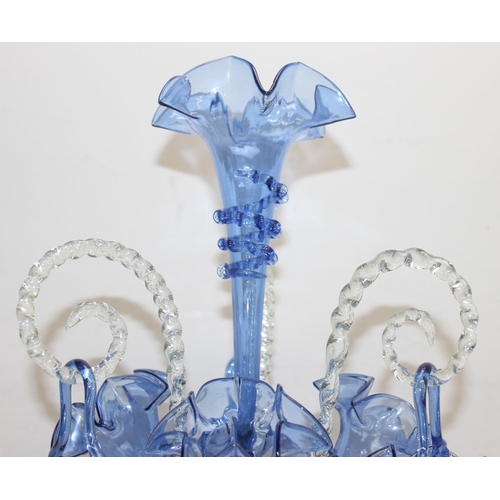 1573 - A large and impressive blue glass epergne, with a central trumpet over three smaller trumpets, all w... 