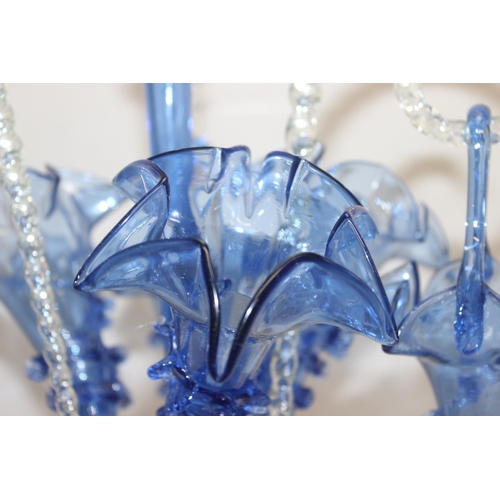 1573 - A large and impressive blue glass epergne, with a central trumpet over three smaller trumpets, all w... 