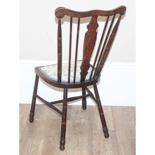 46 - An antique slat back farmhouse Windsor armchair and an antique upholstered bedroom chair with stick ... 