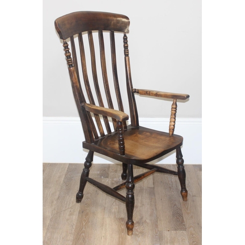 46 - An antique slat back farmhouse Windsor armchair and an antique upholstered bedroom chair with stick ... 